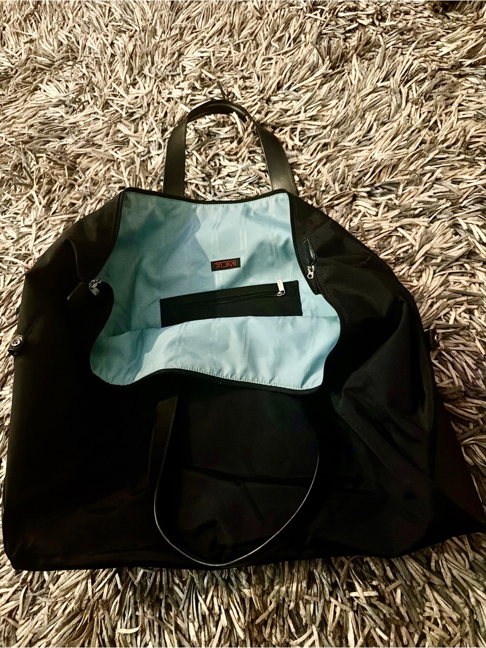Tumi Black Nylon Tote with Light Blue Interior for man or woman good for travel